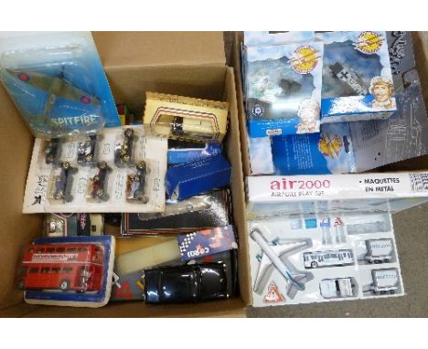 A box of die-cast vehicles and a box of model aeroplanes
