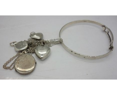 Four silver lockets, three silver chains and a silver bangle, weight 21g