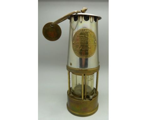 A miner's safety lamp, stamped with owners name P Alton with brass pit check name disc