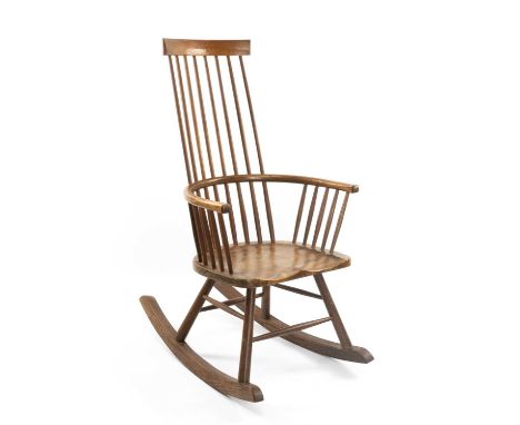 WELSH STICK ROCKING CHAIR BY JOHN BROWN having an elm seat and of elegant form with bowed mid-railAuctioneer's Note: John Bro