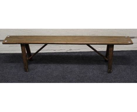 A 19th century elm refectory bench, single piece top on pegged easel supports, 48 x 178 x 22cm