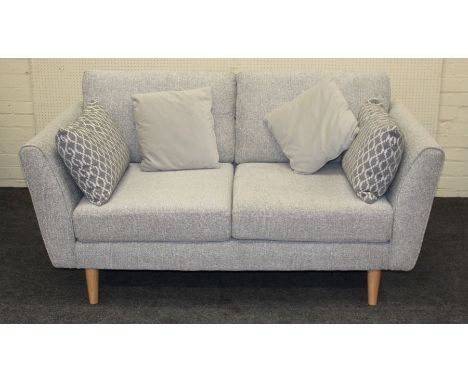 A pair of contemporary light grey upholstered two person settees, each with matching loose cushions, on turned beech supports
