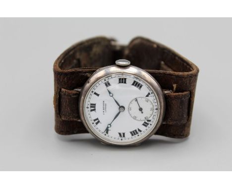 A J W Benson trench watch, on a leather strap. In the original J W Benson box. With white dial, Roman numerals, and a subsidi