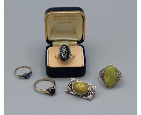 A collection of jewellery. Comprising a "9ct and silver" stamped paste ring, size M; a "9ct + silver" stamped amethyst set ri