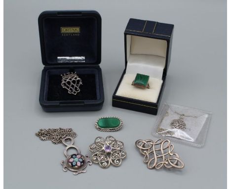 A selection of Scottish silver jewellery, featuring an Ola Gorie Celtic knot brooch, an Ortak Luckenbooth a hallmarked Caithn