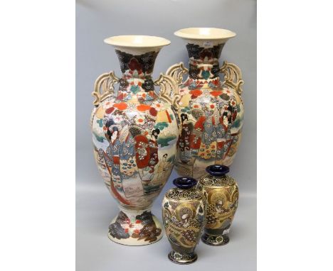 A pair of 1930's Japanese earthenware twin handled baluster vases of large size, each decorated with Geisha and other figures