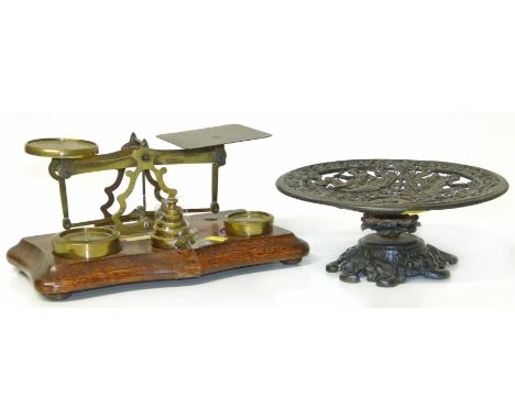Set of Victorian brass postal scales and a cast iron taza. Condition reports are not available for this auction