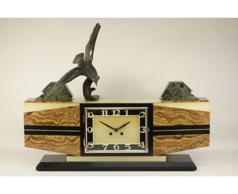 Art Deco period marble an onyx mantel clock, fitted with spelter sea bird figure in flight, W66cm, H52cm CLOCKS & BAROMETERS 
