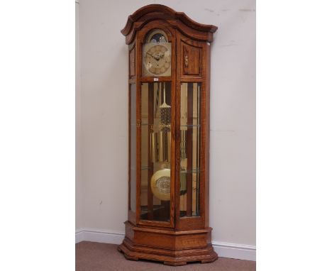 Howard & Miller canted golden oak cased longcase clock, triple weight driven chiming movement, moonphase dial, fitted with si