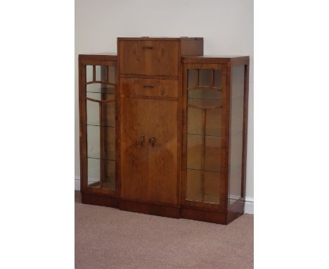 Art Deco period staggered top cock-tail cabinet, double hinged fall front compartment above single drawer and double cupboard