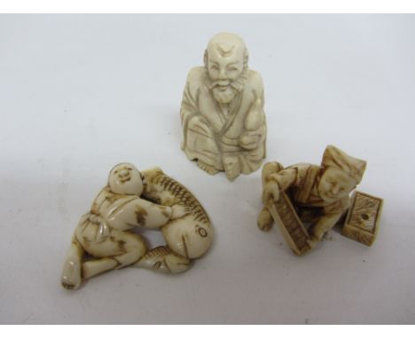 Early 20th century netsuke of a seated figure signed and two others Condition Report Click here for further images, condition