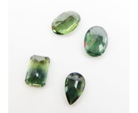 Four loose sapphires, two oval mixed cuts, a pear shape and a parti-coloured step cut; total carat weight 7.47ct