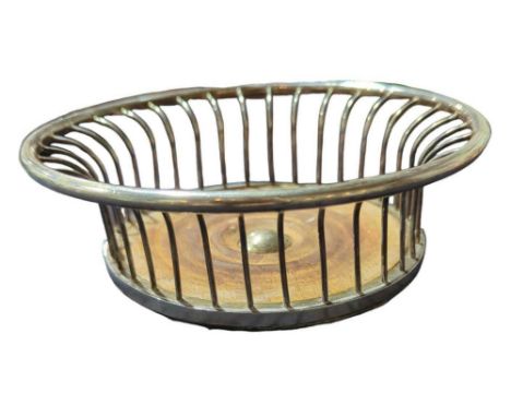 A contemporary Scottish silver wine coaster, no makers mark, Edinburgh, 1971, circular wirework form, turned wooden bases, 17