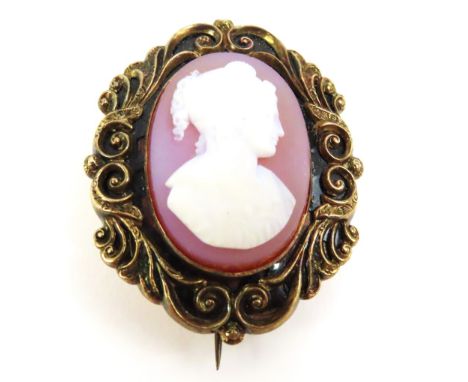 A 19th century mourning brooch, set with a sardonyx cameo, the finely carved cameo depicting a lady in classical dress, the f