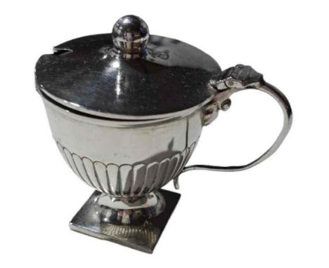 A silver urn shaped lidded mustard, William Hutton & Sons Ltd, Birmingham, 1905; the body half gadrooned, on square base, 2.5