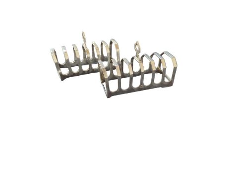 A pair of silver seven-division toast racks, by Viners Ltd, Sheffield, 1937, rectangular form with shaped finial, 4.6oz