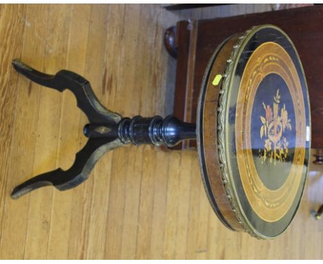 A 19th century French lacquered circular centre table with elaborate marquetry to the top, carved brass rim, one drawer under