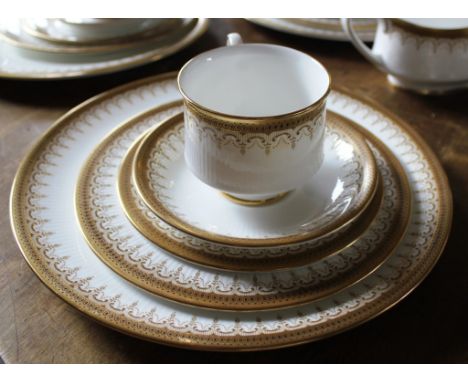 A sixty-one piece Paragon Stoke-On-Trent dinner and tea service with stylised gold rims, to include plates, tureens, cups, sa