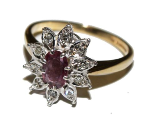 A 9 carat ruby and diamond ring