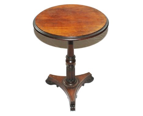 A Regency rosewood circular wine or occasional table with moulded top, raised on a baluster fluted single column with egg and