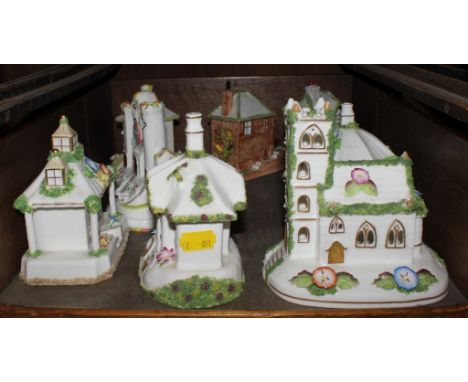 An assortment of Coalport fine bone china model houses, to include 'The Gate House', 'Village Church', etc (8)