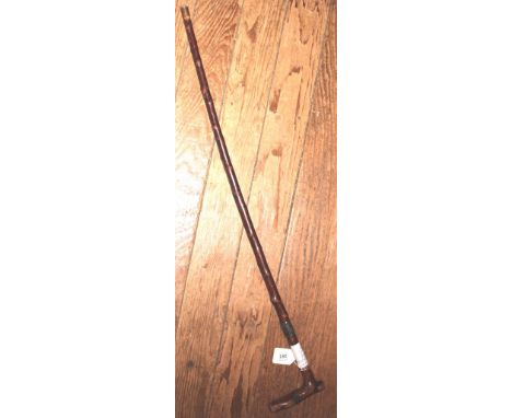 A late Victorian walking stick with solid silver band, Birmingham 1899, and a copper tip, 80cm long