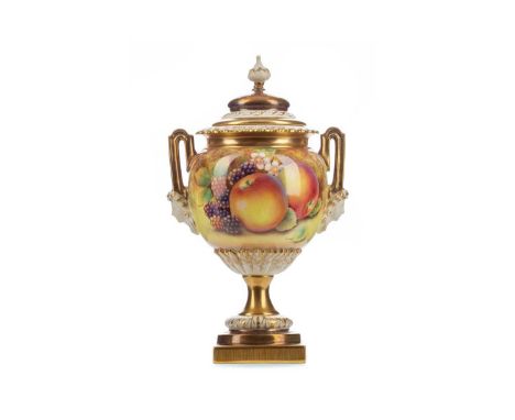 ROYAL WORCESTER LIDDED URN,of ovoid form with twin mask-detailed handles, hand painted with fruits by David Fuller, on waiste