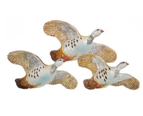 GRADUATED SET OF THREE BESWICK FLYING PARTRIDGE WALL PLAQUES,model 1188, printed and impressed marks, the largest 15cm highMe