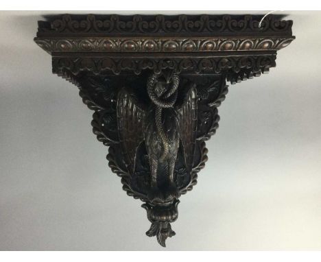 IMPRESSIVE LATE 19TH/EARLY 20TH CENTURY CARVED WALNUT WALL BRACKET,the baize lined oblong top with pierced fleur-de-lis galle