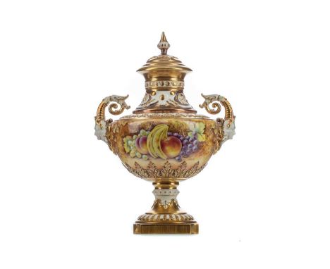 ROYAL WORCESTER LIDDED URN,moulded with scrolling foliage and with twin mask-detailed handles, hand painted with fruits by Da