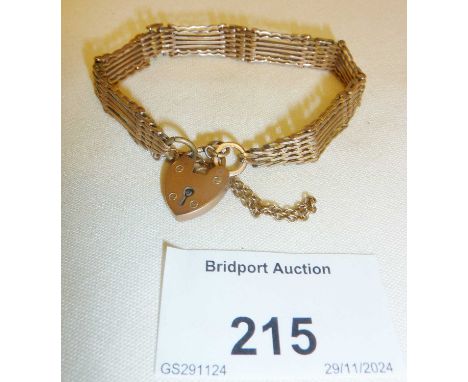 9ct gold rose gold gate bracelet with heart padlock. Approx. 15cm long and 12.5g.