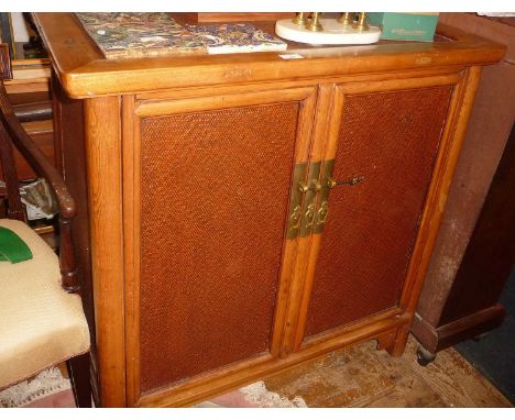 Vintage Chinese bamboo and rattan cupboard with 2 doors enclosing shelves and 2 drawers. 97 cm tall x 92 cm wide c 52 cm deep
