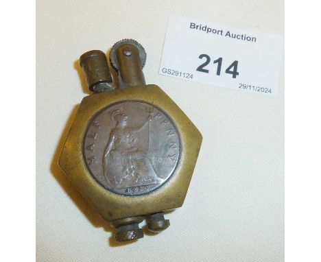Brass trench art lighter mounted with a penny