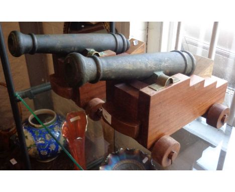 Pair of 19thc French bronze cannons on later truck carriage, 34cm barrel and 2cm bore having open touch holes