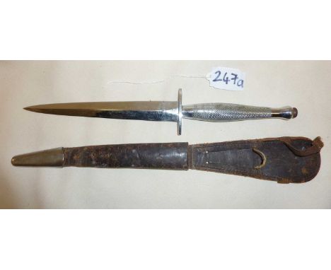 WW2 Fairbairn Sykes Commando Trench Knife with leather scabbard, marked with military crows foot and B2 to hilt in a chrome f