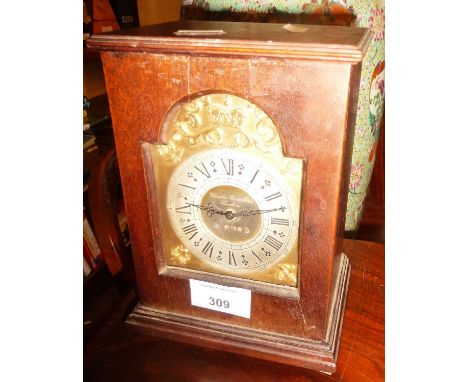 A Charles Frodsham 1977 Jubilee table clock, having brass and silver (hallmarked) dial (missing pendulum)