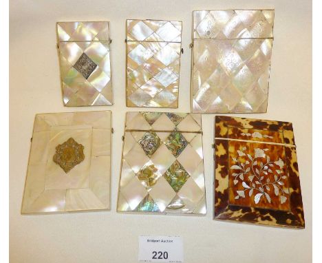 Five inlaid mother of pearl push button card cases, and another tortoiseshell