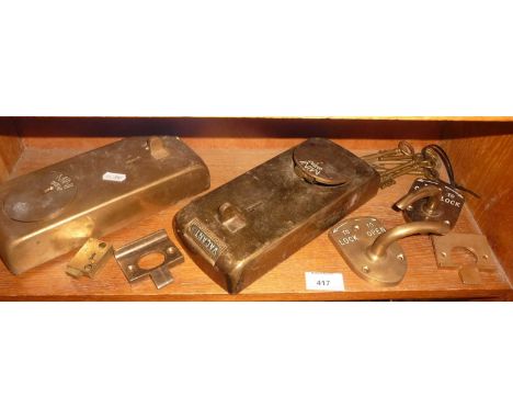 Two vintage bronze penny in the slot machines from public toilets and other door furniture.