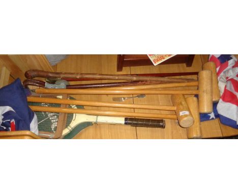 Jacques Croquet mallets, shooting sticks, tennis rackets and two flags 