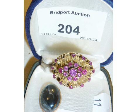9ct gold cocktail ring with red stones (one missing). Marked as PT5525, adjustable size, approx. UK size K and weight 4g