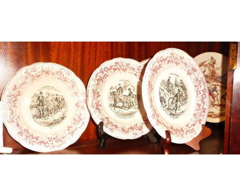 Four French porcelain plates with decoration of antique bicycles early 20thc and a Sarreguemines china plate titled locomotio