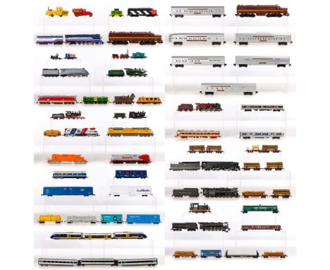 Model Train HO Scale Assortment  Approximately (35) items including locomotives, tenders, hoppers, log cars, cabooses, oil ta