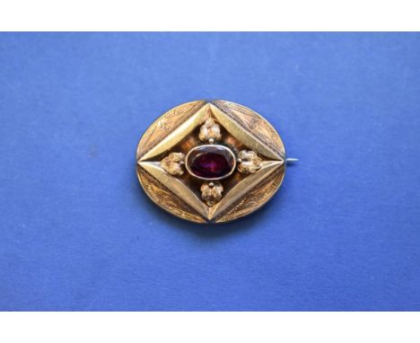 A Victorian unmarked gold memento mori brooch,&nbsp;set oval amethyst with glass hair compartment to reverse, 4cm. 