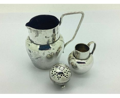 A Victorian Hallmarked Silver Cream Jug, JW, Birmingham 1876, of baluster form with scroll cap handle (damages), together wit