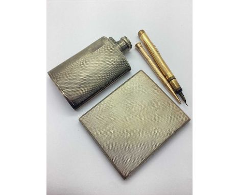 A Hallmarked Silver Cigarette Case, W.T.T &amp;Co, Birmingham 1934, of rectangular form with allover engine turned design, th
