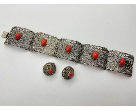 A Vintage Ornate Stone Set Panel Bracelet, each oval cabochon stone collet set to centre of highly decorative openwork foliag