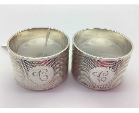 Viners; A Pair of Hallmarked Silver Napkin Rings, Sheffield 1939, of allover engine turned design and initialled "C" to circu