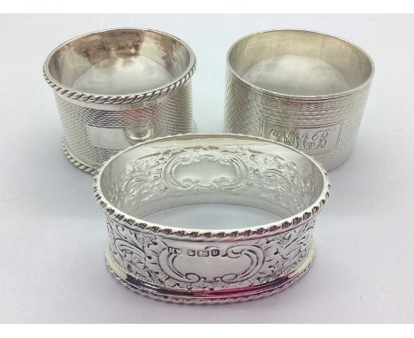 Three Hallmarked Silver Napkin Rings, Edwardian hallmarked of allover foliage design with wavy rim and vacant cartouche front