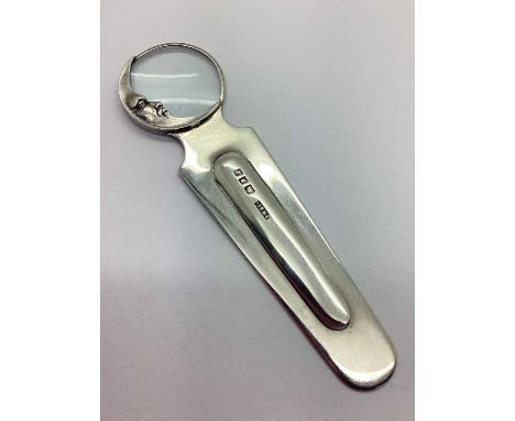 Sampson Mordan &amp; Co; A Hallmarked Silver Novelty Crescent Moon Bookmark, London 1926, the finial with magnifying glass an