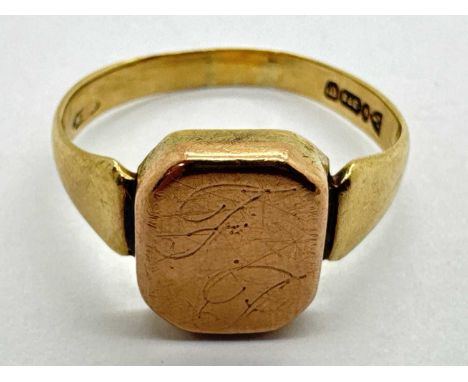 A 9ct Chester Gold Gent's Signet Ring, the engraved rectangular centre panel (worn), between wide tapered shoulders (finger s